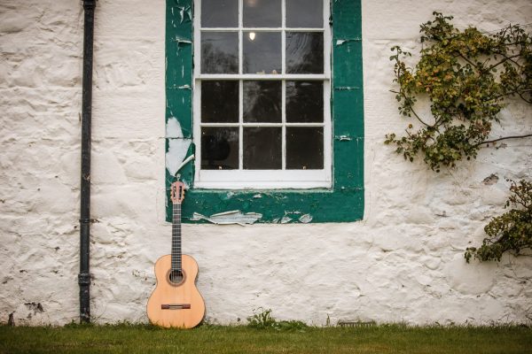 A guitar leaning against the wall of Ellisland